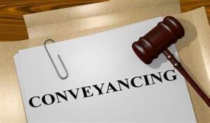 Conveyancing written on paper, with gavel